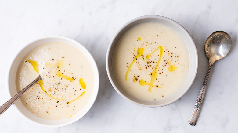 two bowls of creamy cauliflower soup