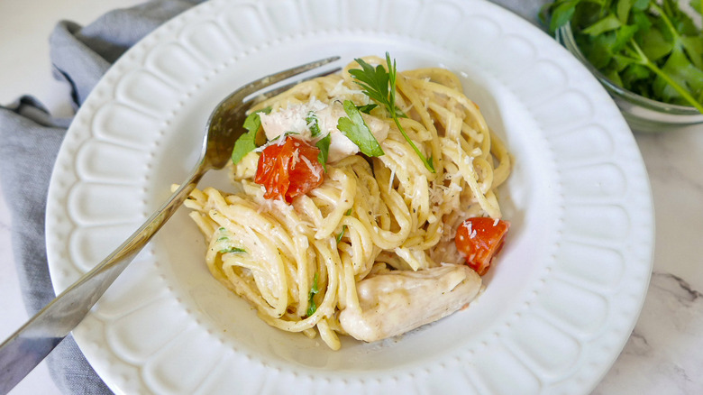 creamy chicken spaghetti in dish 