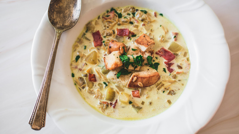 one bowl of clam chowder with spoon