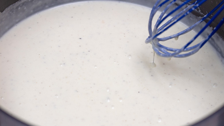 whisk milk, cream into roux