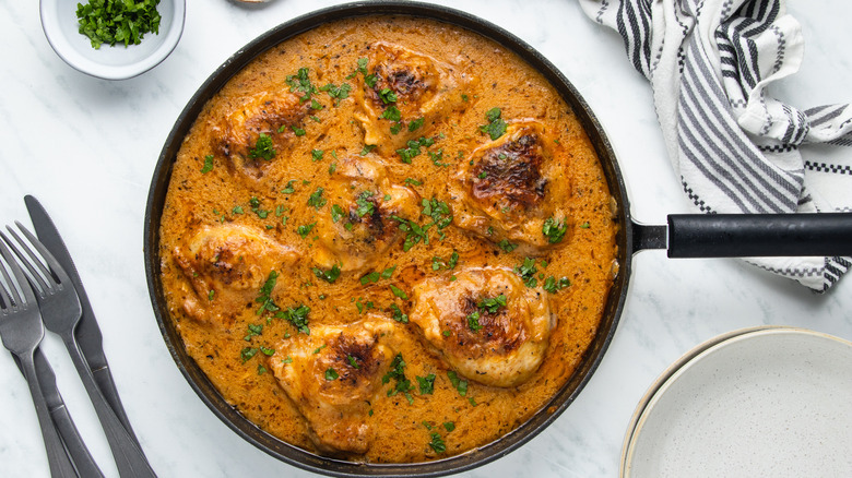 creamy smothered chicken in pan 