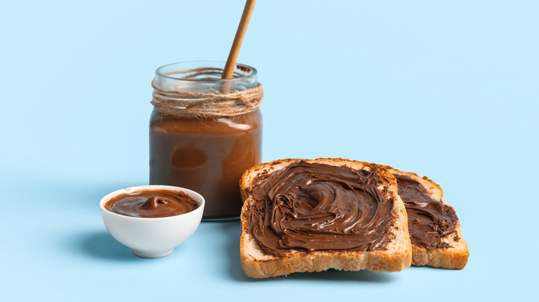 Homemade Oreo cookie butter in jar and bowl and on toast