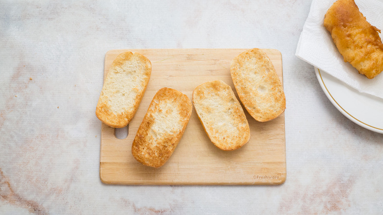 toasted rolls on marble table