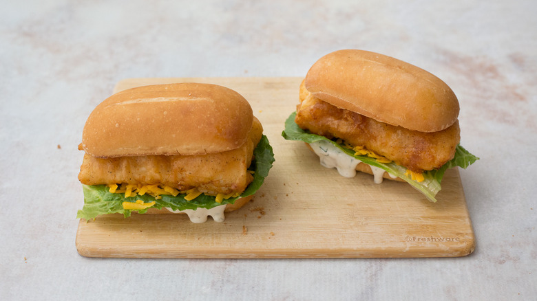 fish sandwiches on wooden board