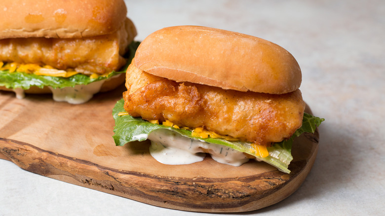 fish sandwiches on wooden board
