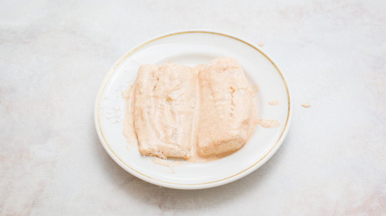 battered fish on white plate