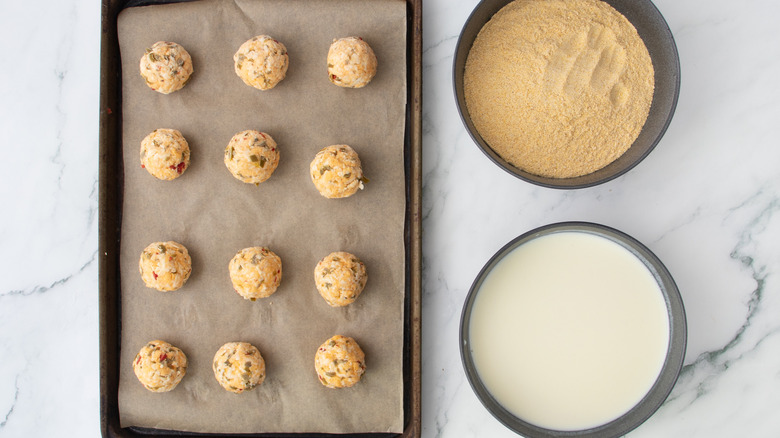cheese balls on a baking pan