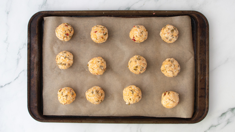 cheese balls on a baking pan