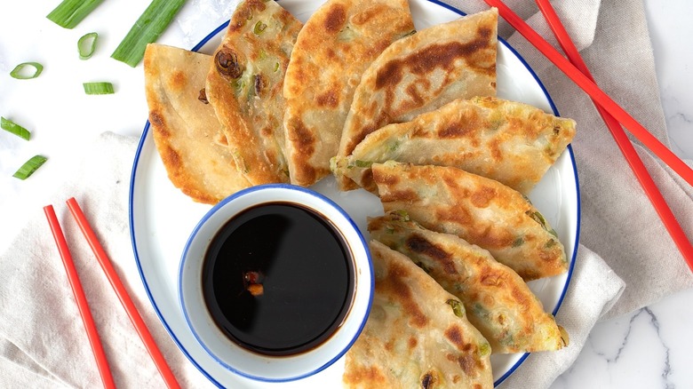 scallion pancake triangles with sauce