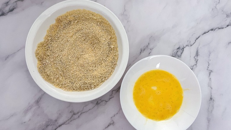 dishes of breadcrumbs and raw egg