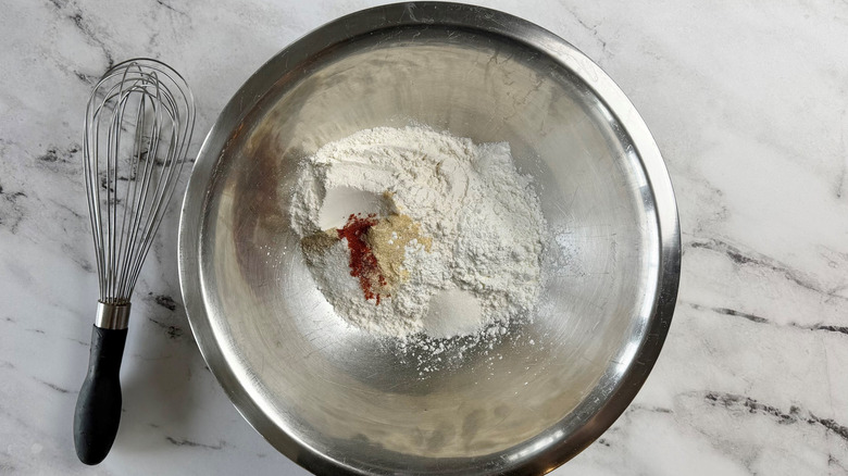 flour and seasonings in a metal bowl