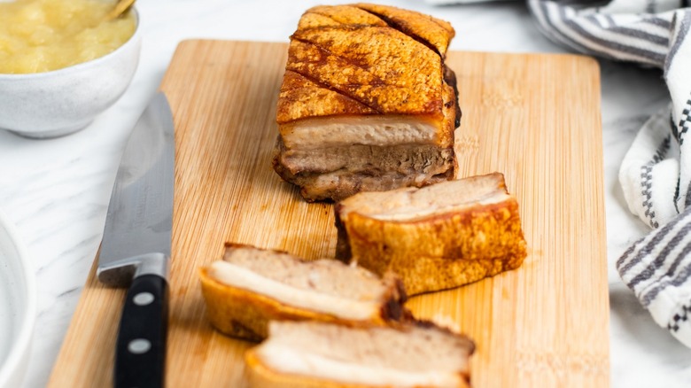 sliced pork belly on board