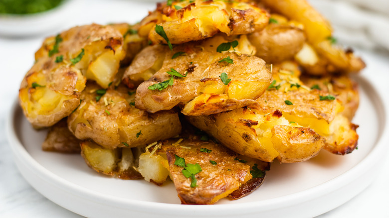 smashed potatoes on plate