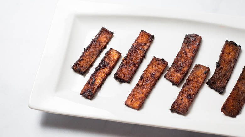 tofu bacon on white dish