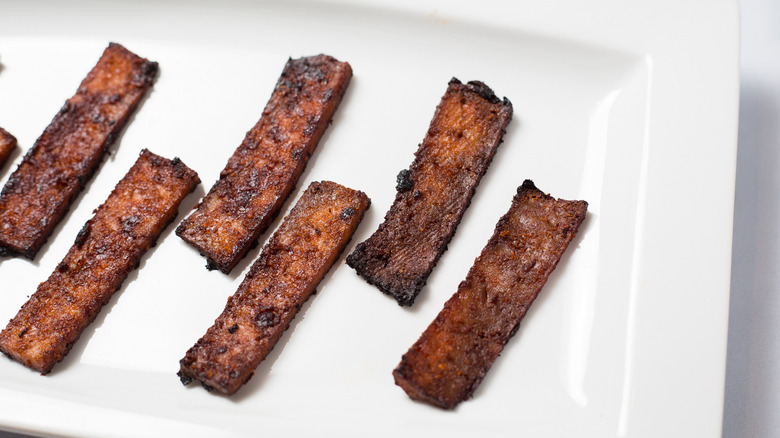 vegan bacon on white dish
