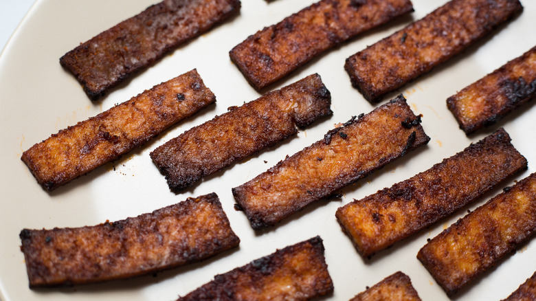 tofu bacon on beige dish