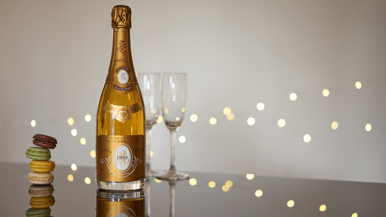Cristal Champagne near macaroons and two flutes