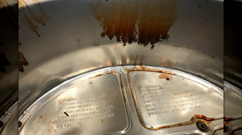 Stained slow cooker heating base