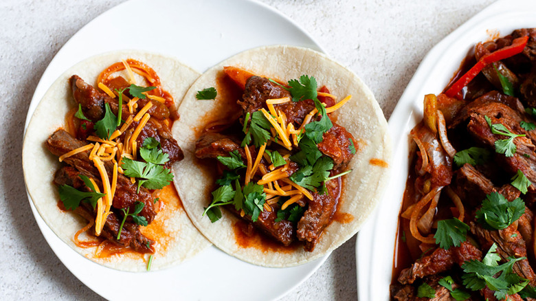 Steak fajitas on white plate