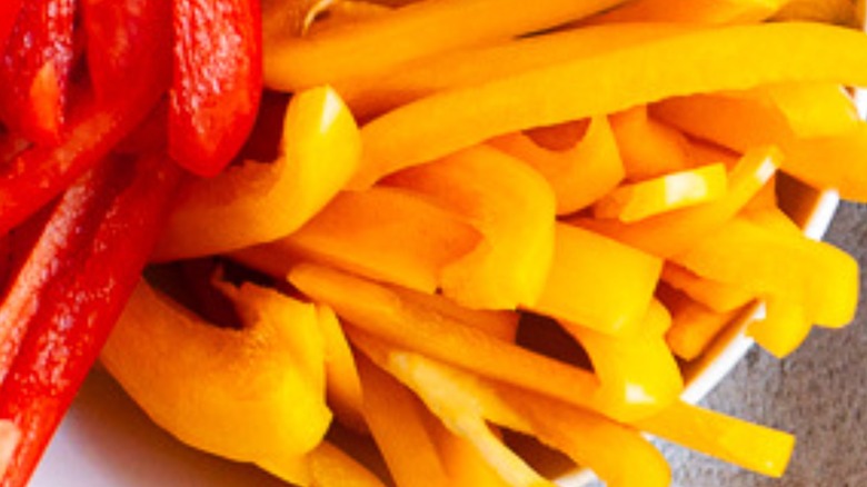 Sliced red and yellow peppers