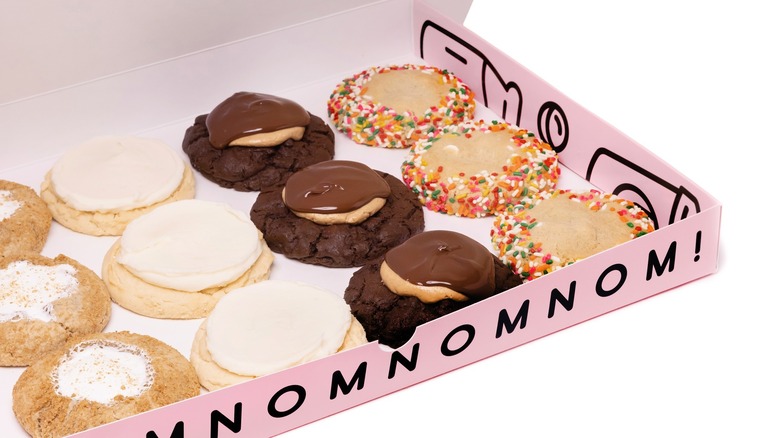 Pink box with assorted Crumbl Cookies 