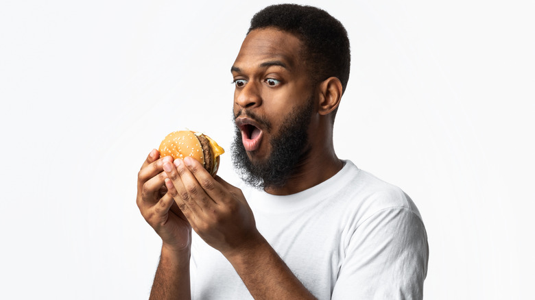 Man eating burger