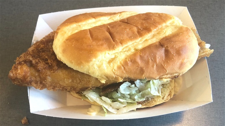 Breaded fish sandwich on tray