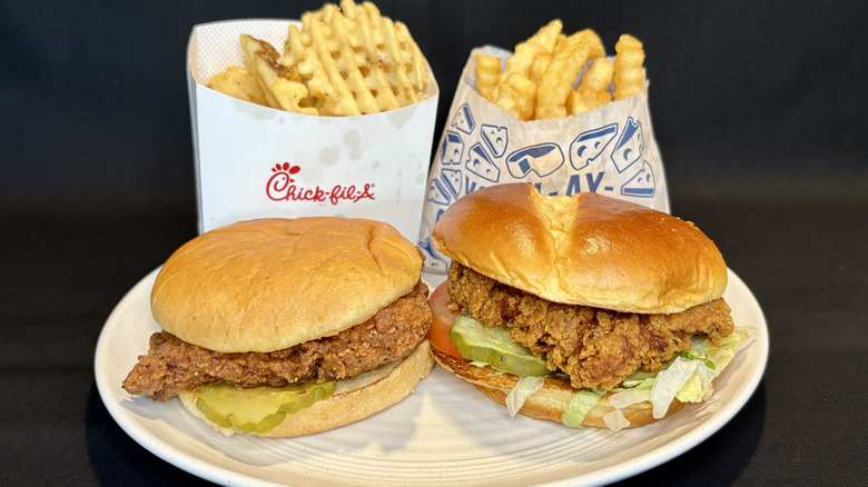 Culver's and Chick-fil-A Spicy Chicken sandwiches on plate with fries behind