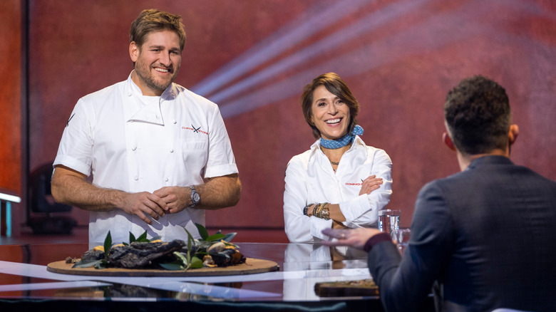 Iron Chefs Curtis Stone and Dominique Crenn smiling