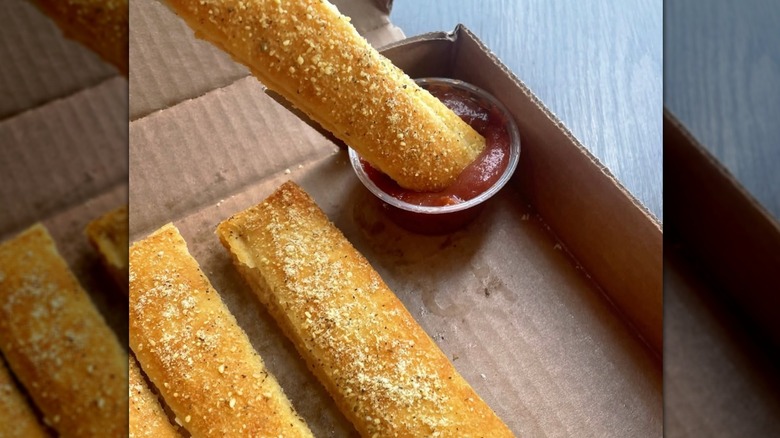 Pizza Hut breadsticks and marinara sauce