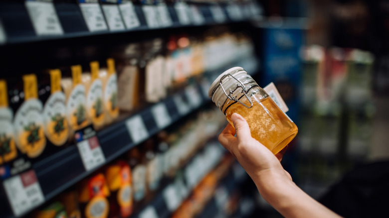 woman shopping for honey