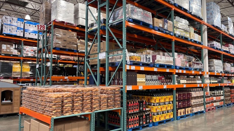 Inside a Costco warehouse with an assortment of products stacked high on shelves.
