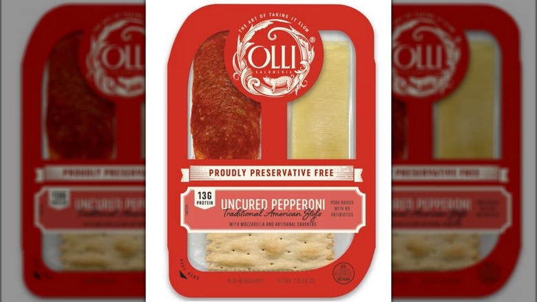 Snack pack with pepperoni, cheese, and crackers against white background.