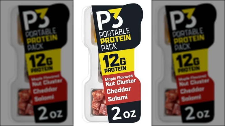 Snack pack with nut clusters, cheddar cheese, and salami.