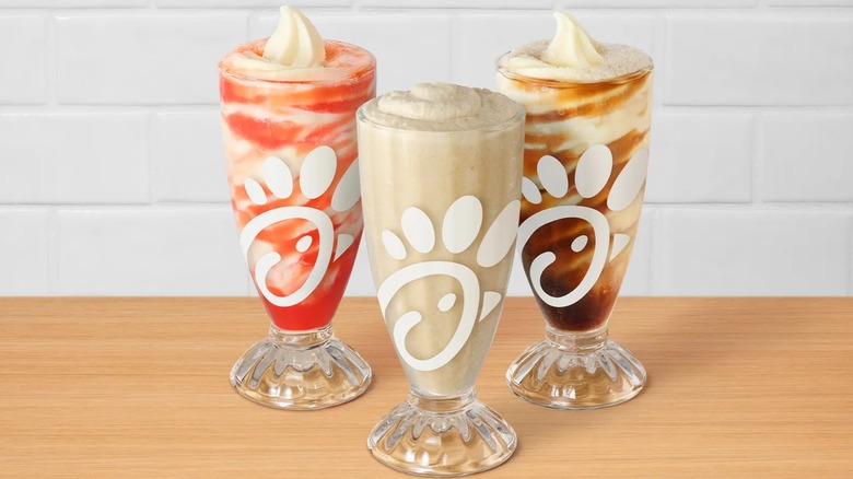 Three types of Frosted Beverages from Chick-fil-A in branded glasses.
