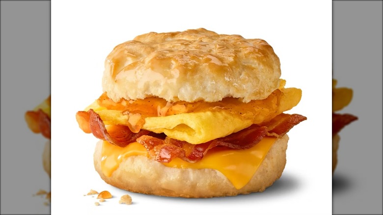A bacon, egg, and cheese biscuit with honey brown butter sauce at McDonald's.