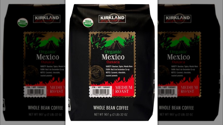 Bag of Kirkland Signature organic Mexico whole bean coffee against white background.