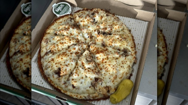 Papa Johns pan pizza in cardboard box.