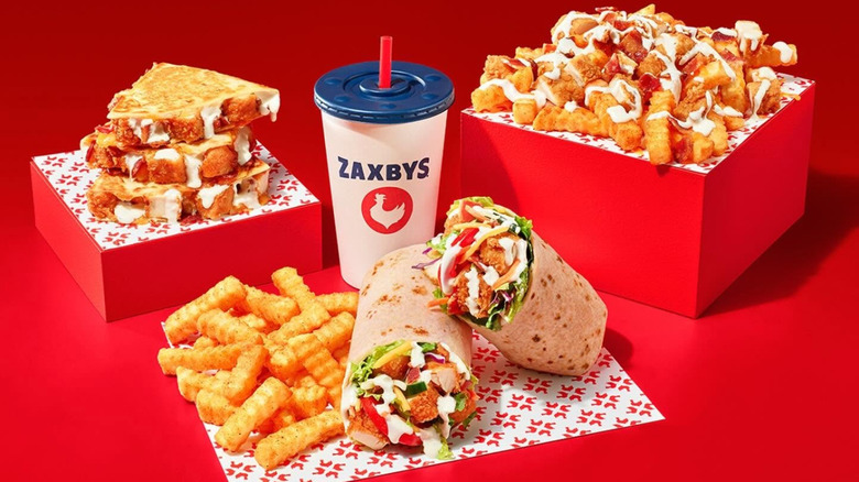 Zaxbys' chicken bacon ranch items with red background