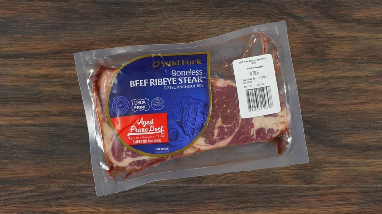 Screenshot of a Guga Foods video showing a vacuum-sealed USDA Prime ribeye steak from Wild Fork