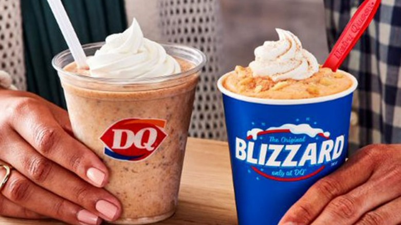 People holding Dairy Queen drinks