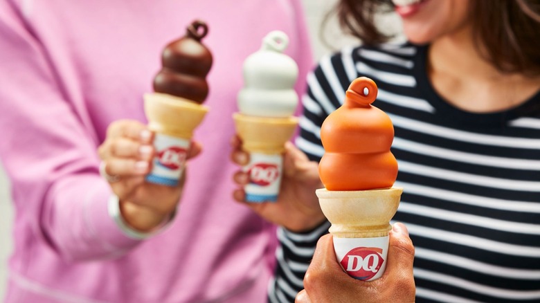 People holding Dairy Queen Dipped Cones