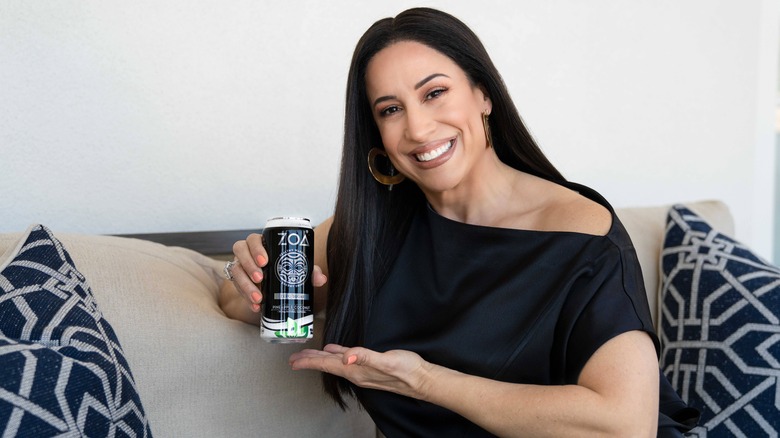 Dany Garcia holds ZOA can
