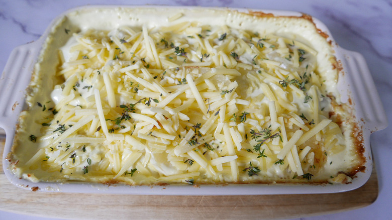 potatoes and cheese in pan