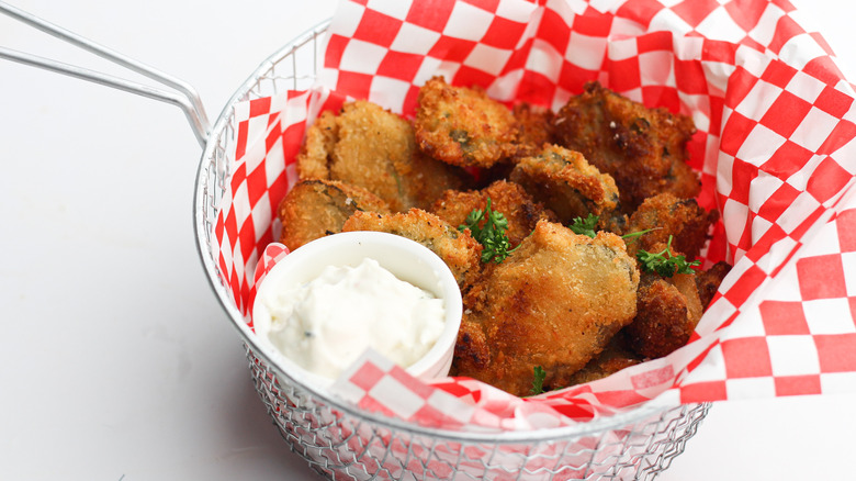 fried dill pickles in basket