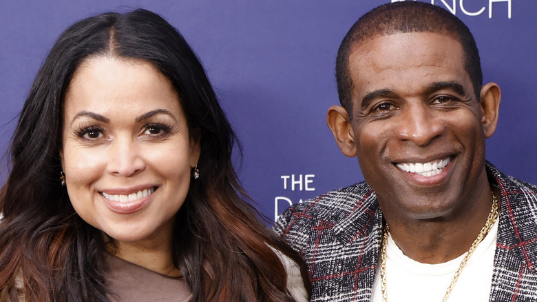 Tracey Edmonds and Deion Sanders smiling