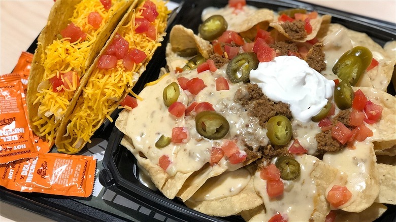 A tray of tacos and nachos from Del Taco