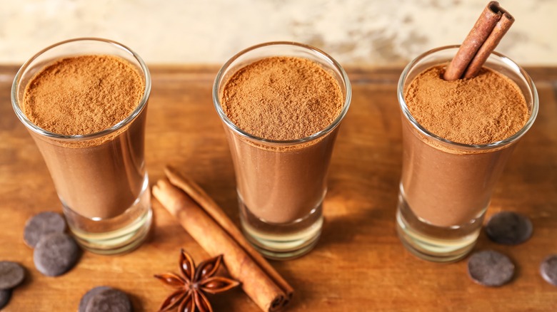 chocolate pudding in shot glasses with cinnamon