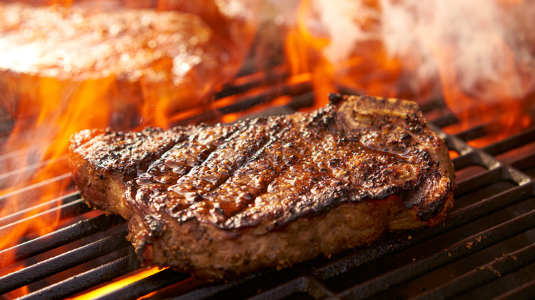 steak cooking on grill