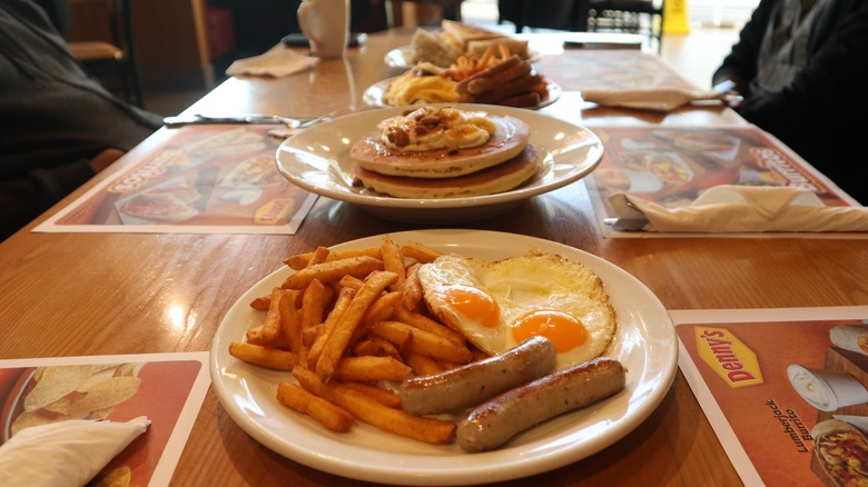 Denny's table with breakfast platters